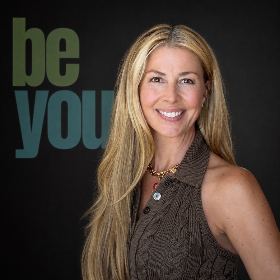 Kim Wise in front of the BE YOU backdrop